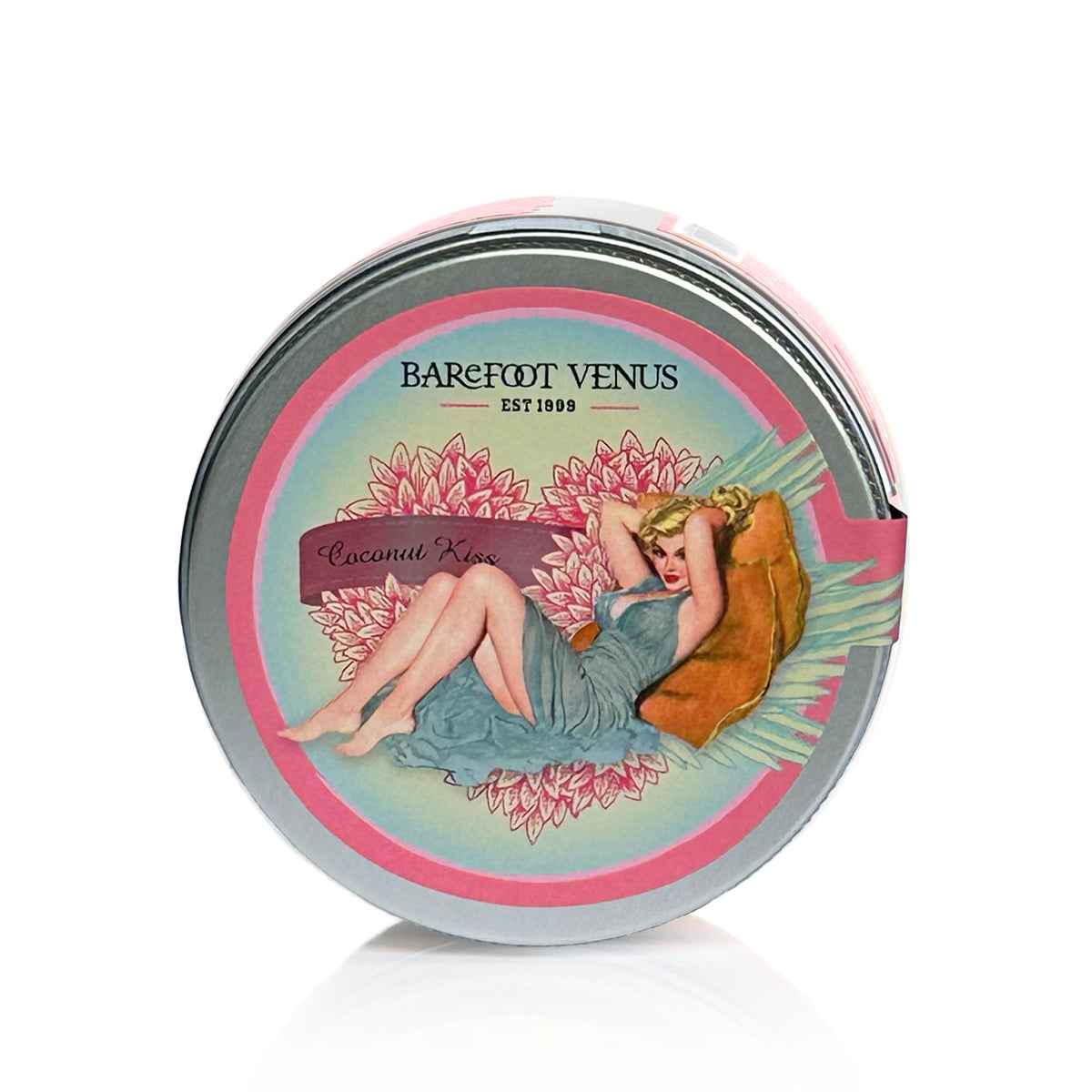Container of Barefoot Venus Coconut Kiss sugar scrub product featuring a woman in a blue dress with a floral background design on a white background.