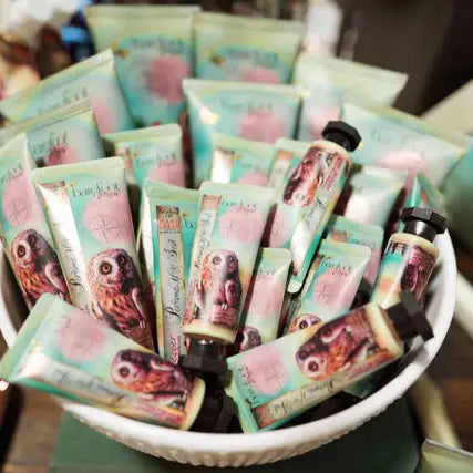 Barefoot Venus Pink Pepper hand creams in a bowl with colourful packaging featuring an owl.