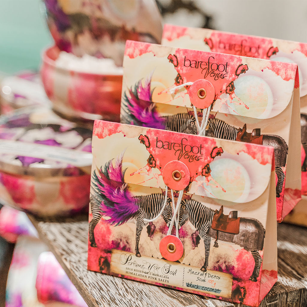 Envelope of Barefoot Venus Black Coconut bath soak envelope product featuring a floral zebra design.