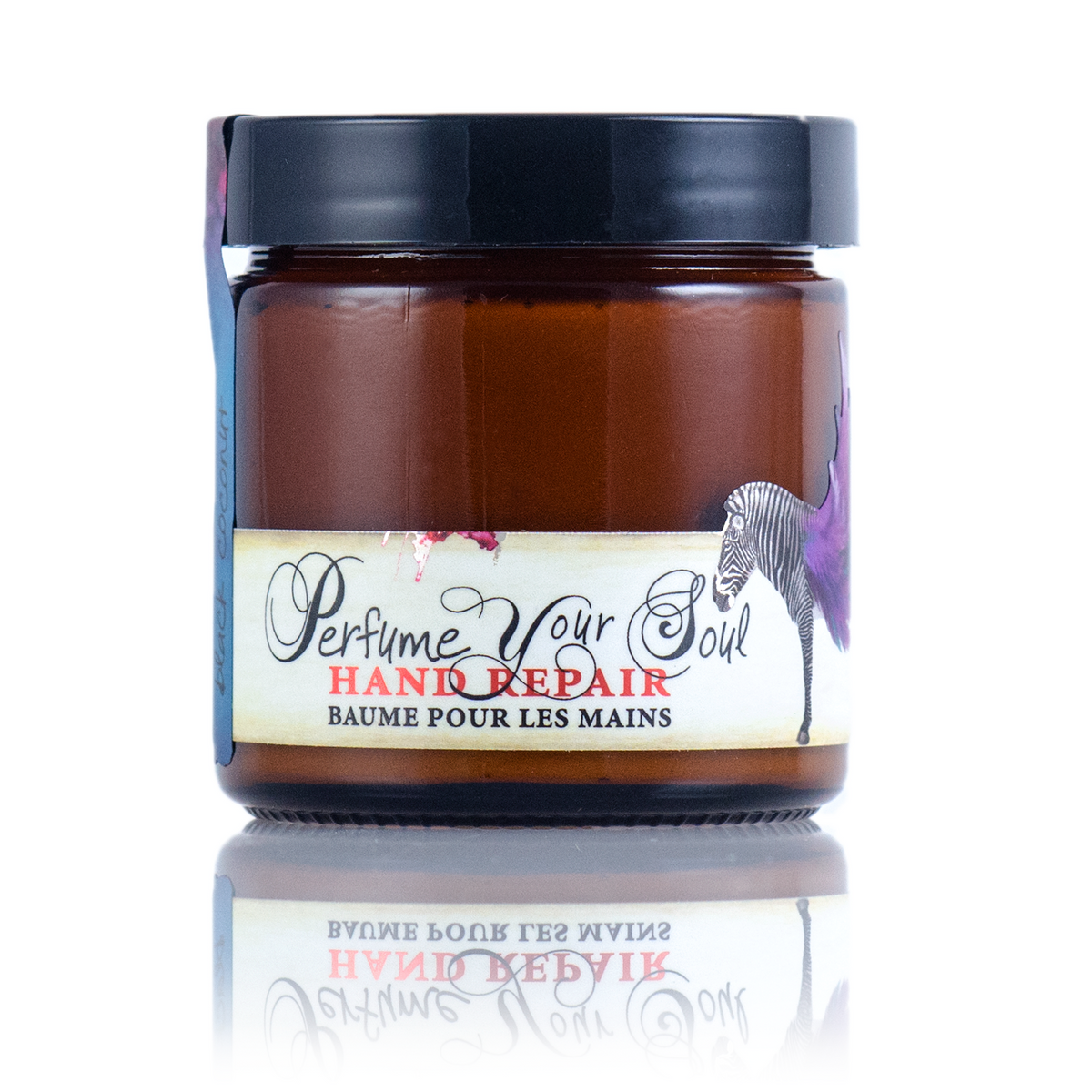 A jar of Barefoot Venus Black Coconut instant hand repair with a black lid and a floral zebra design.
