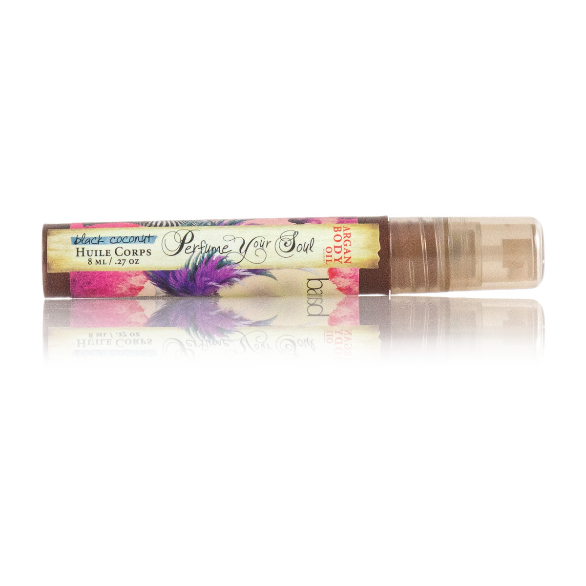 A mini spray bottle of Barefoot Venus Black Coconut Argan body oil with a floral design on the packaging.
