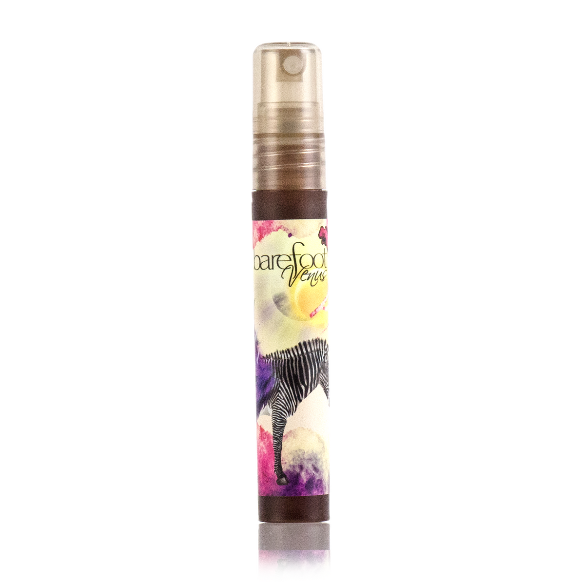 A mini spray bottle of Barefoot Venus Black Coconut Argan body oil with a floral zebra design on the packaging.