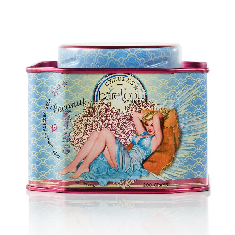 Tin of Barefoot Venus Coconut Kiss Himalayan pink salt product featuring a woman in a blue dress with a floral background design on a white background.