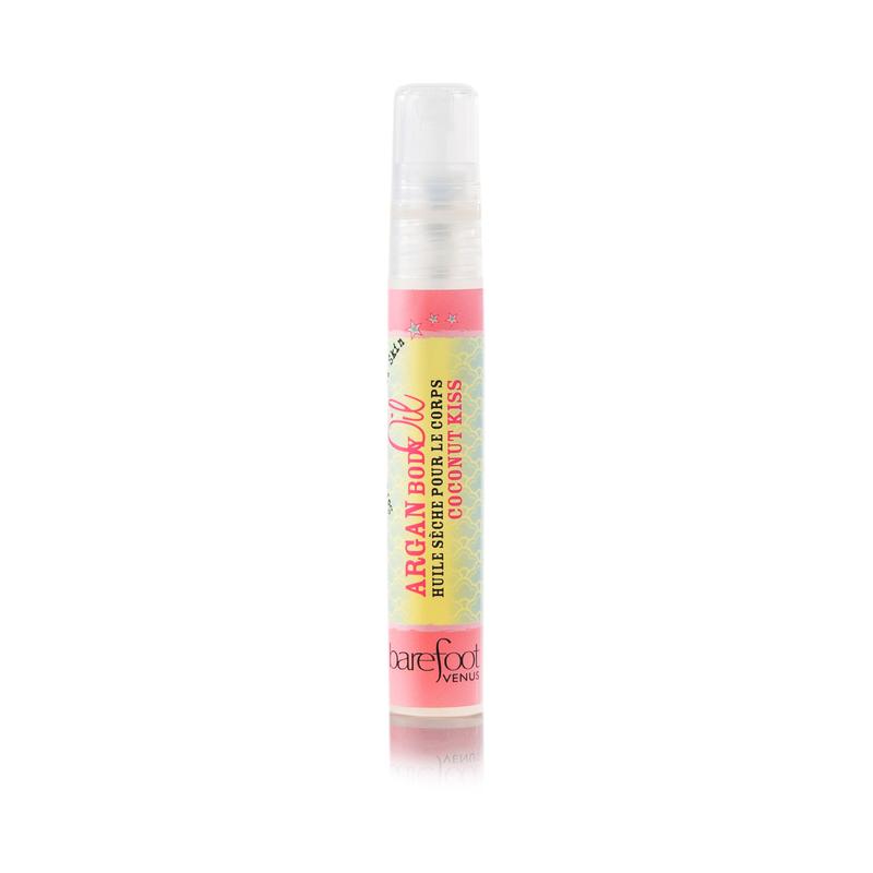 A mini spray bottle of Barefoot Venus Coconut Kiss Argan body oil with pink and yellow packaging on a white background.