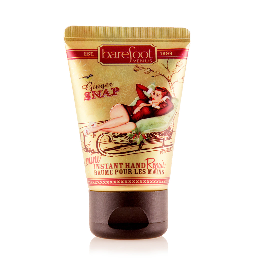Tube of Barefoot Venus Ginger Snap instant hand repair mini product featuring a woman in a red outfit lying in a toboggan design on a white background.