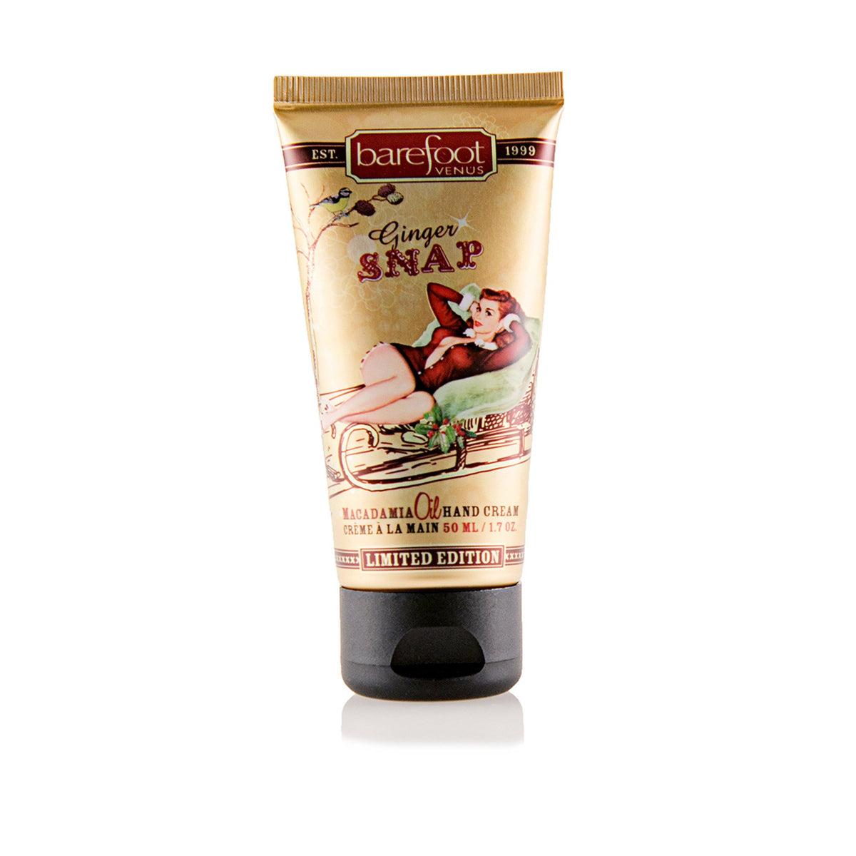 Tube of Barefoot Venus Ginger Snap macadamia oil hand cream product featuring a woman in a red outfit lying in a toboggan design on a white background.