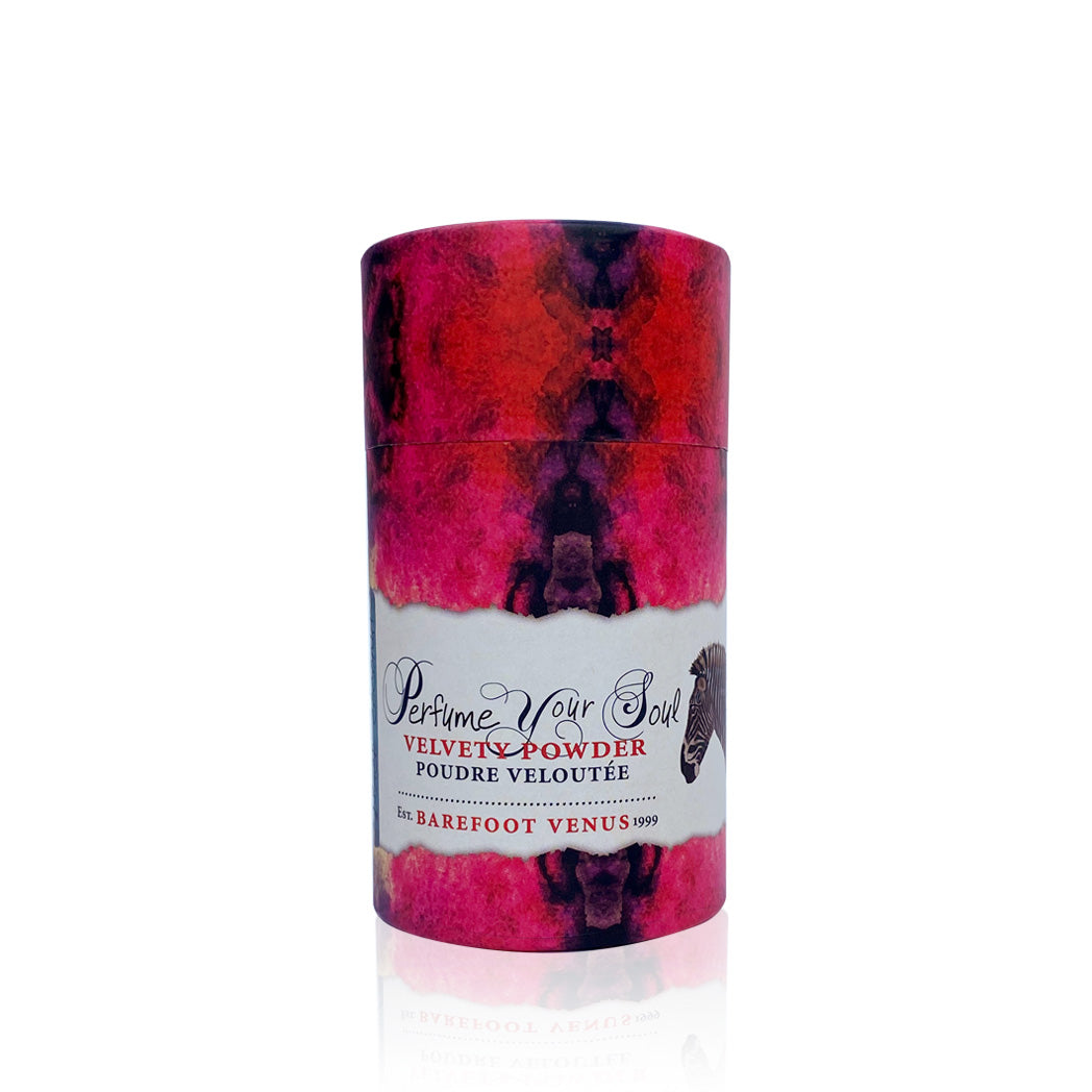 Large container of Barefoot Venus Black Coconut velvety powder with a pink and purple label on a white background