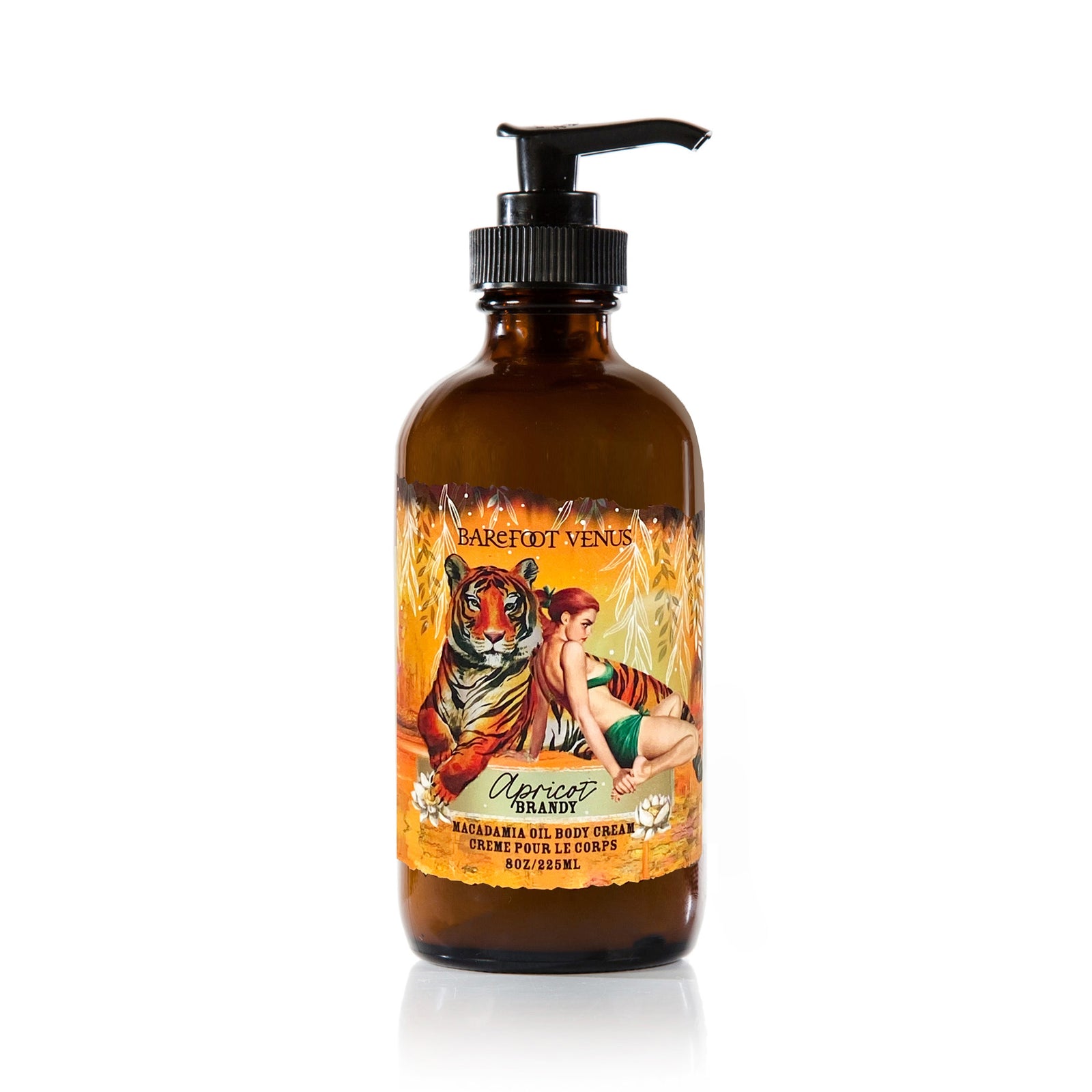 A person holding a pump bottle of Apricot Brandy body cream with a label featuring illustrations of tiger and woman.