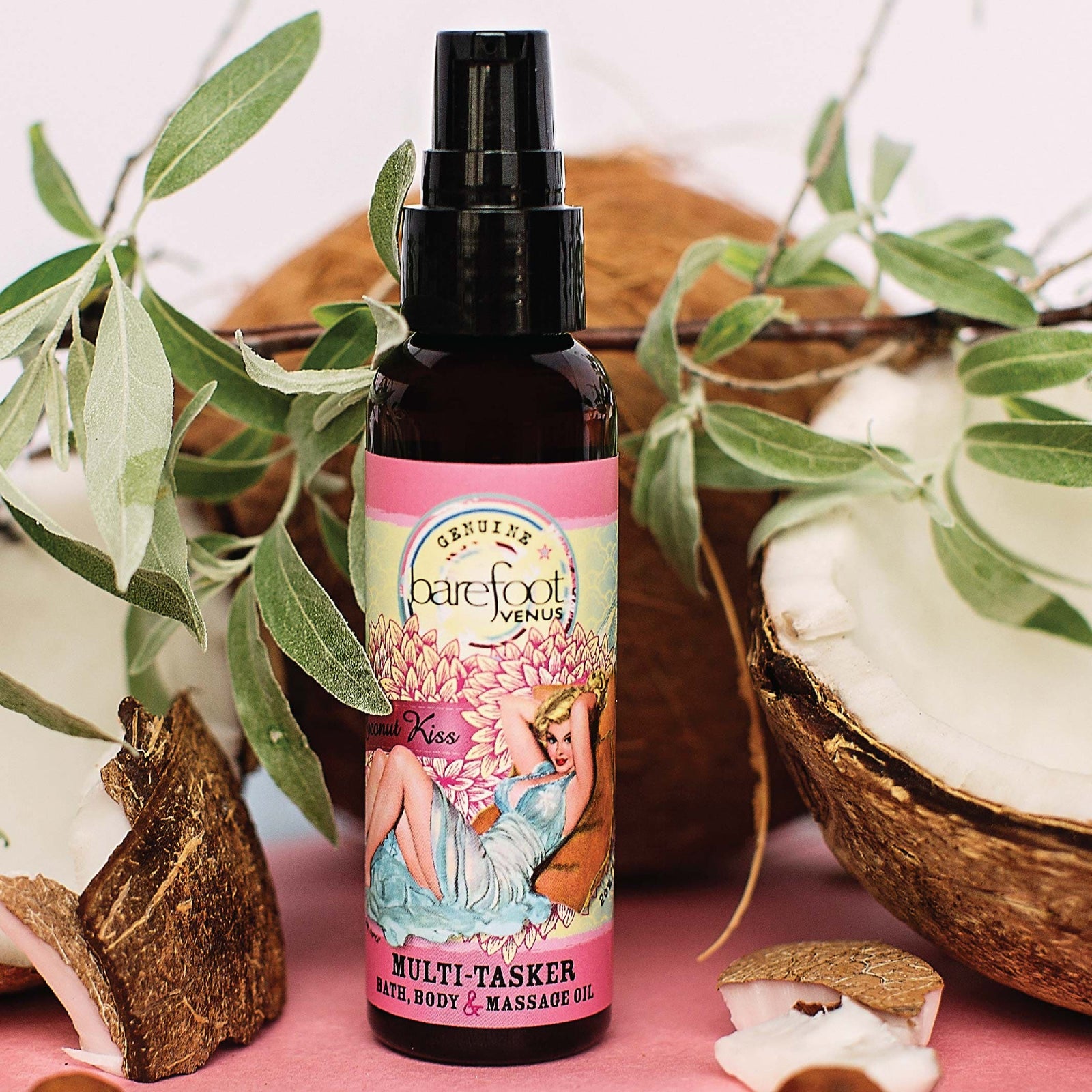 Spray bottle of Barefoot Venus Coconut Kiss multi-tasker featuring a woman in a blue dress with a floral background design with a white background.