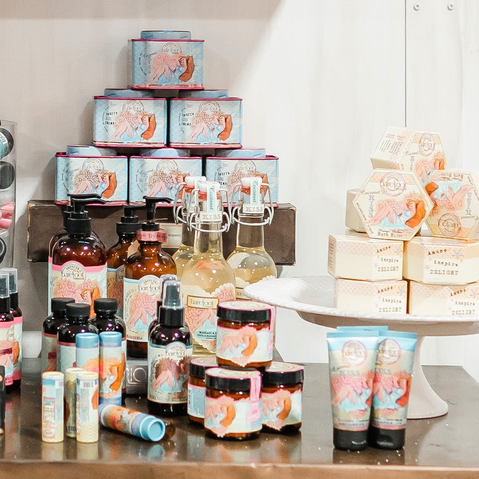 Barefoot Venus Coconut Kiss products displayed on a table.