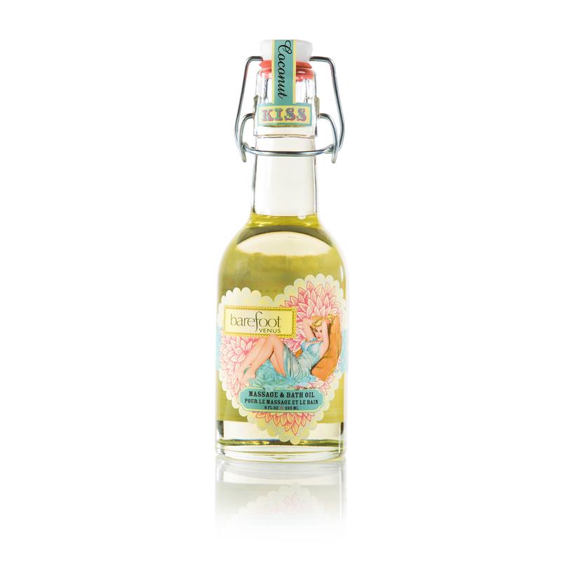 Person pouring Barefoot Venus Coconut Kiss massage & bath oil with woman in blue dress with floral background design on bottle into bath tub. 