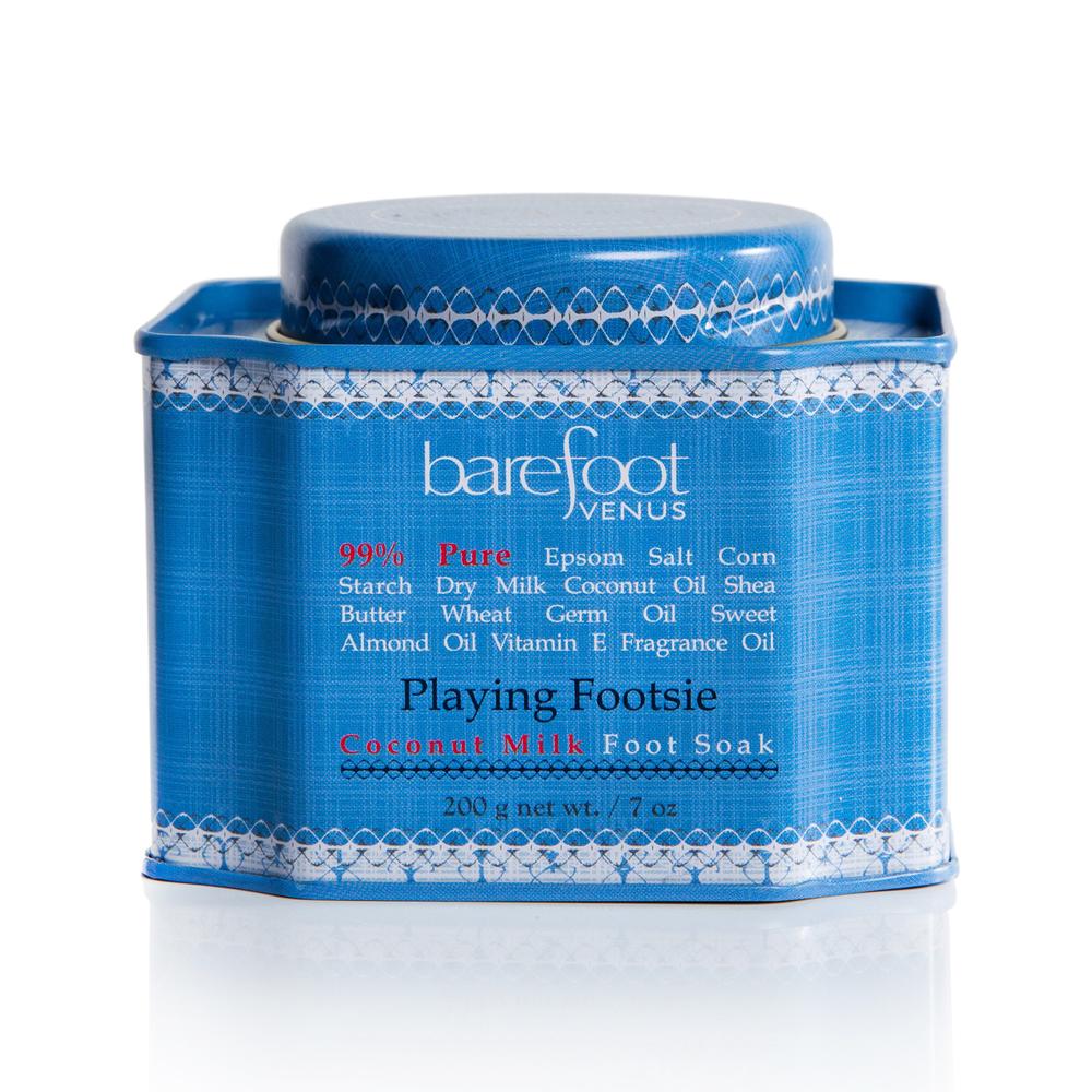 Tin of Barefoot Venus Playing Footsie foot soak with a blue label and a white background.