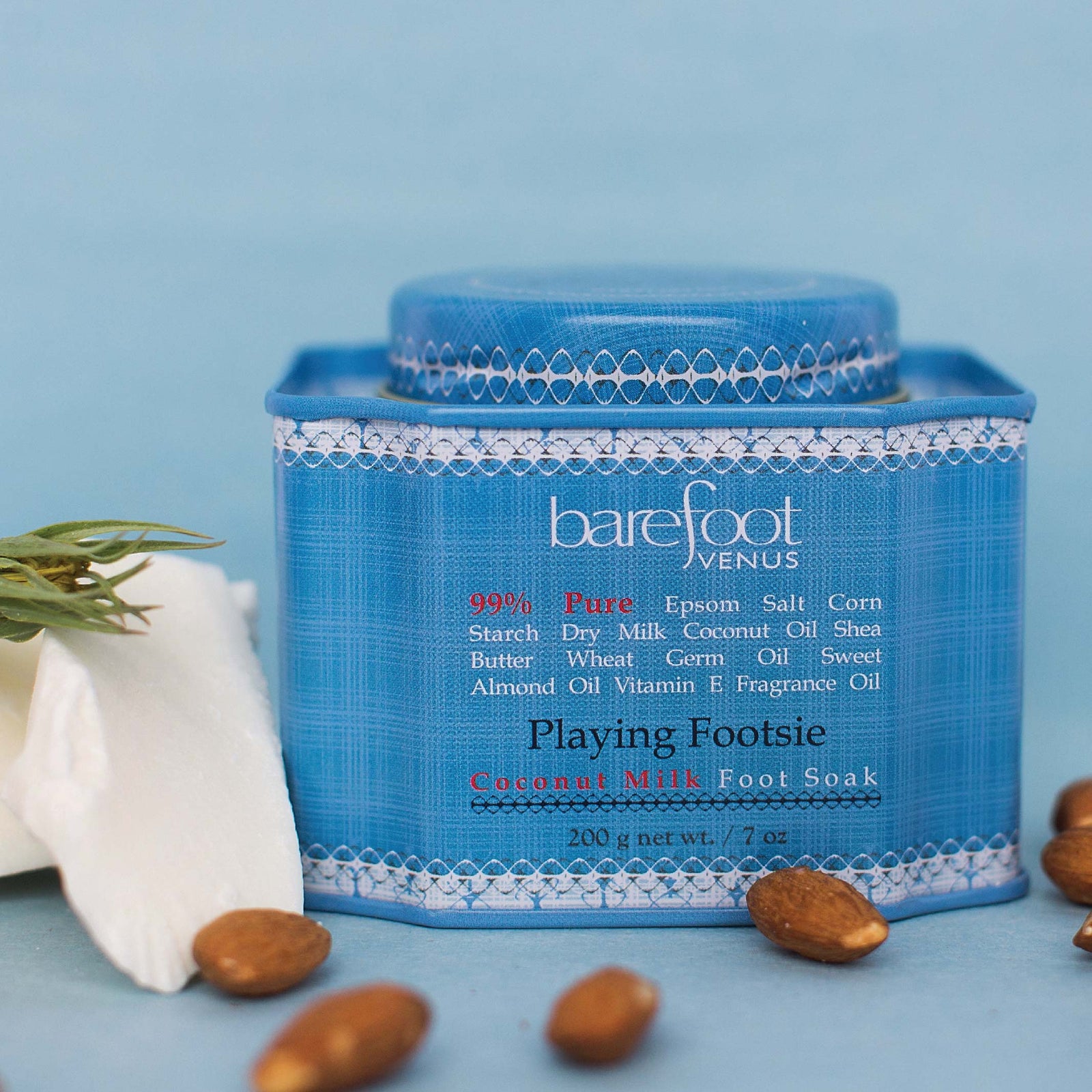 Tin of Barefoot Venus Playing Footsie foot soak with a blue label and a white background.