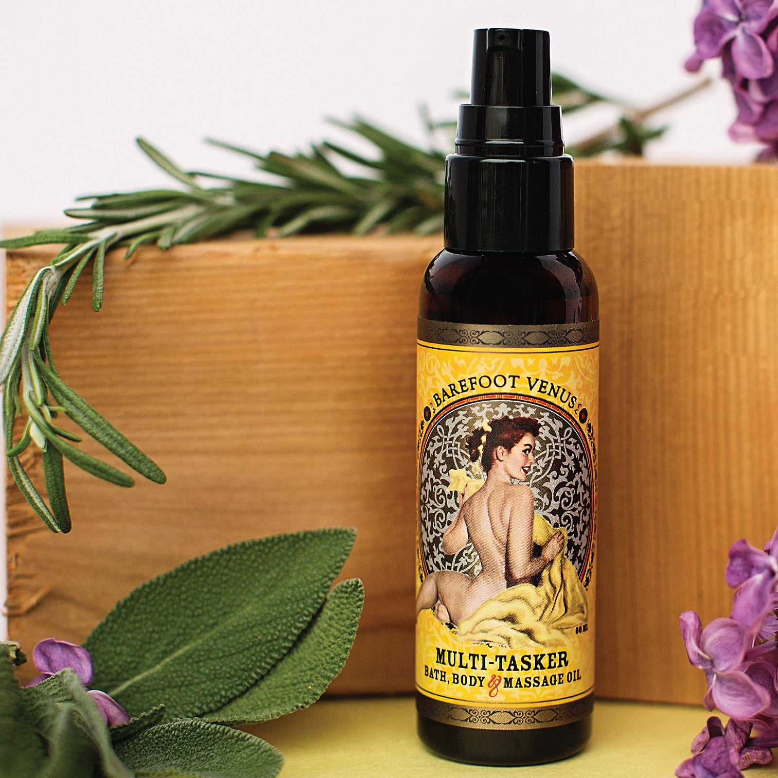 Spray bottle of Barefoot Venus Essential Oil multi-tasker with a vintage woman design on the packaging on a white background.